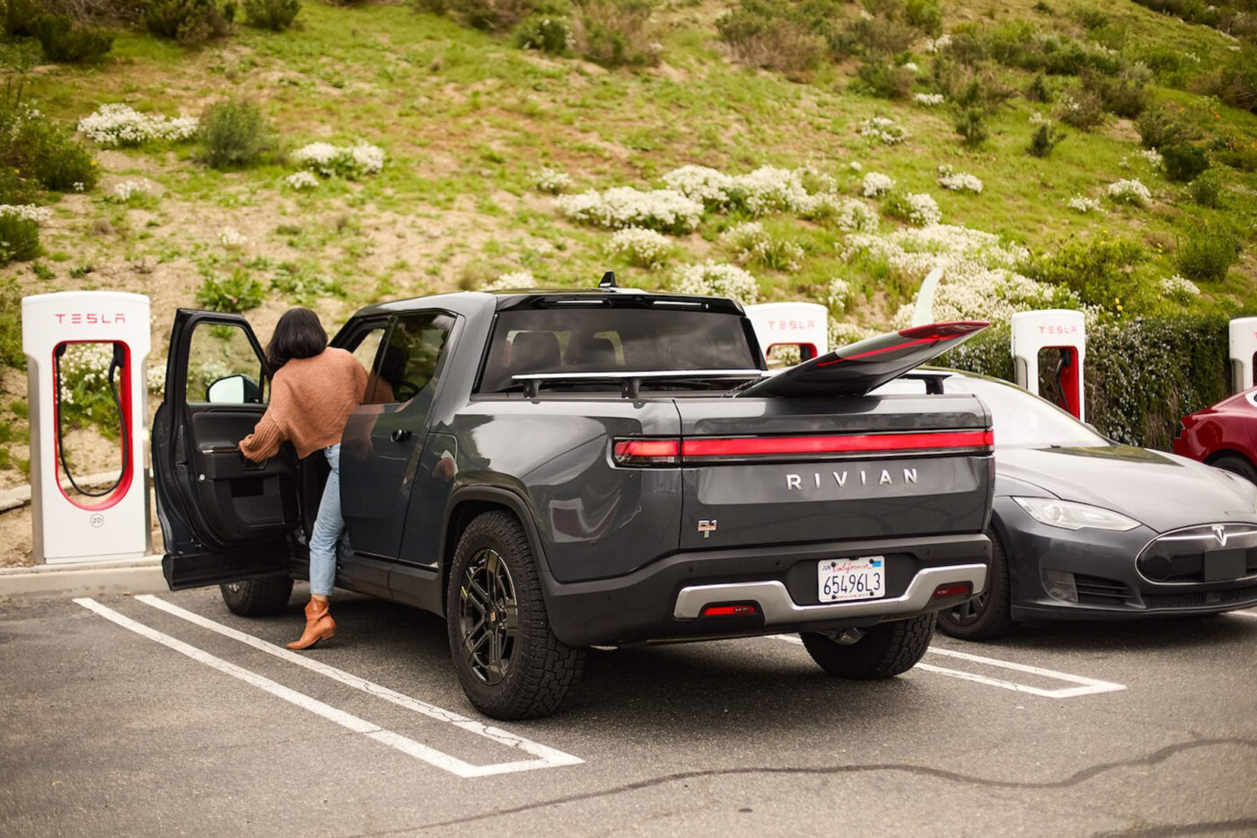 rivian r1t tesla supercharger 2024
